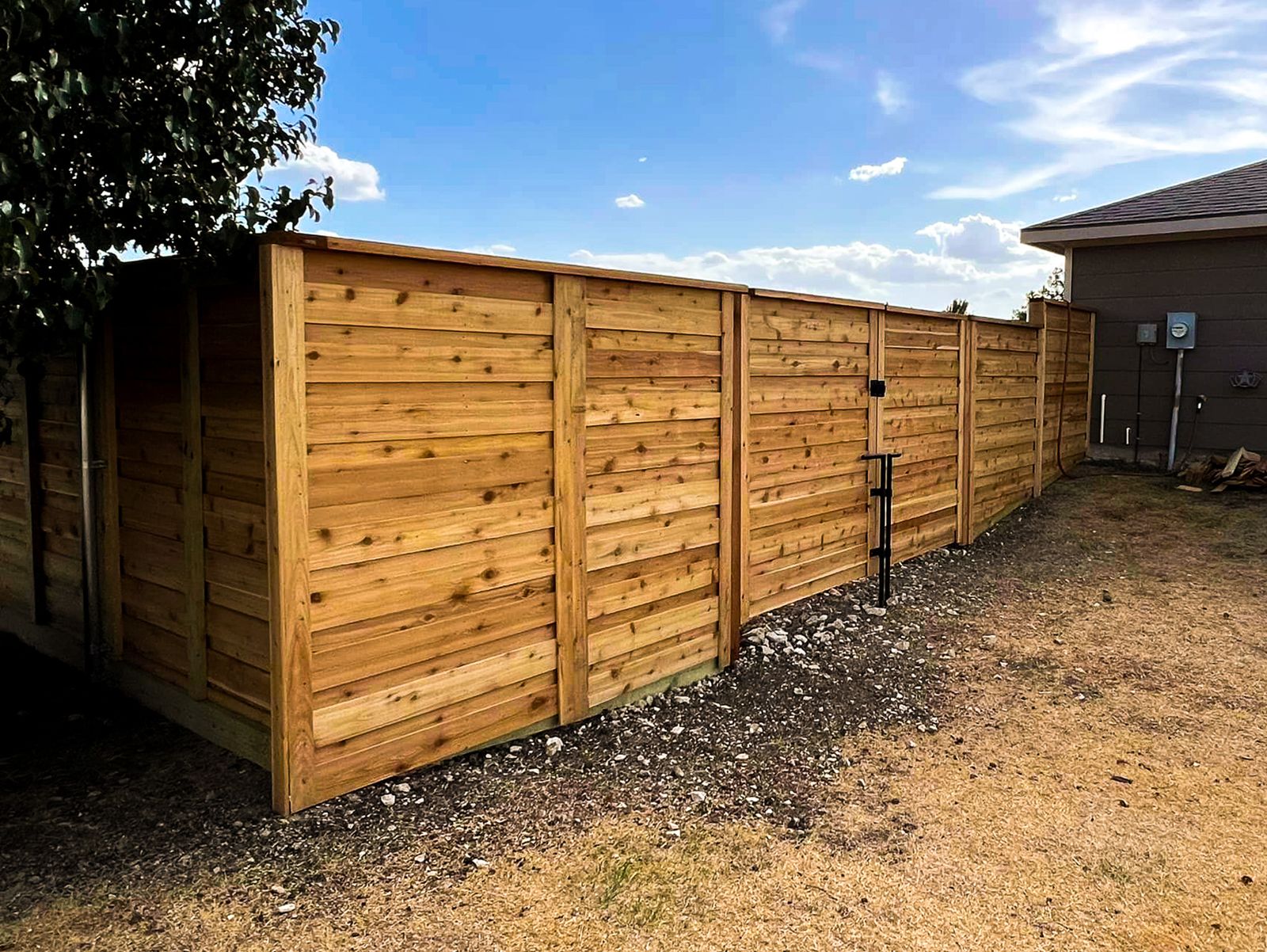 Horizontal cedar fence installed in a Fort Worth, TX backyard