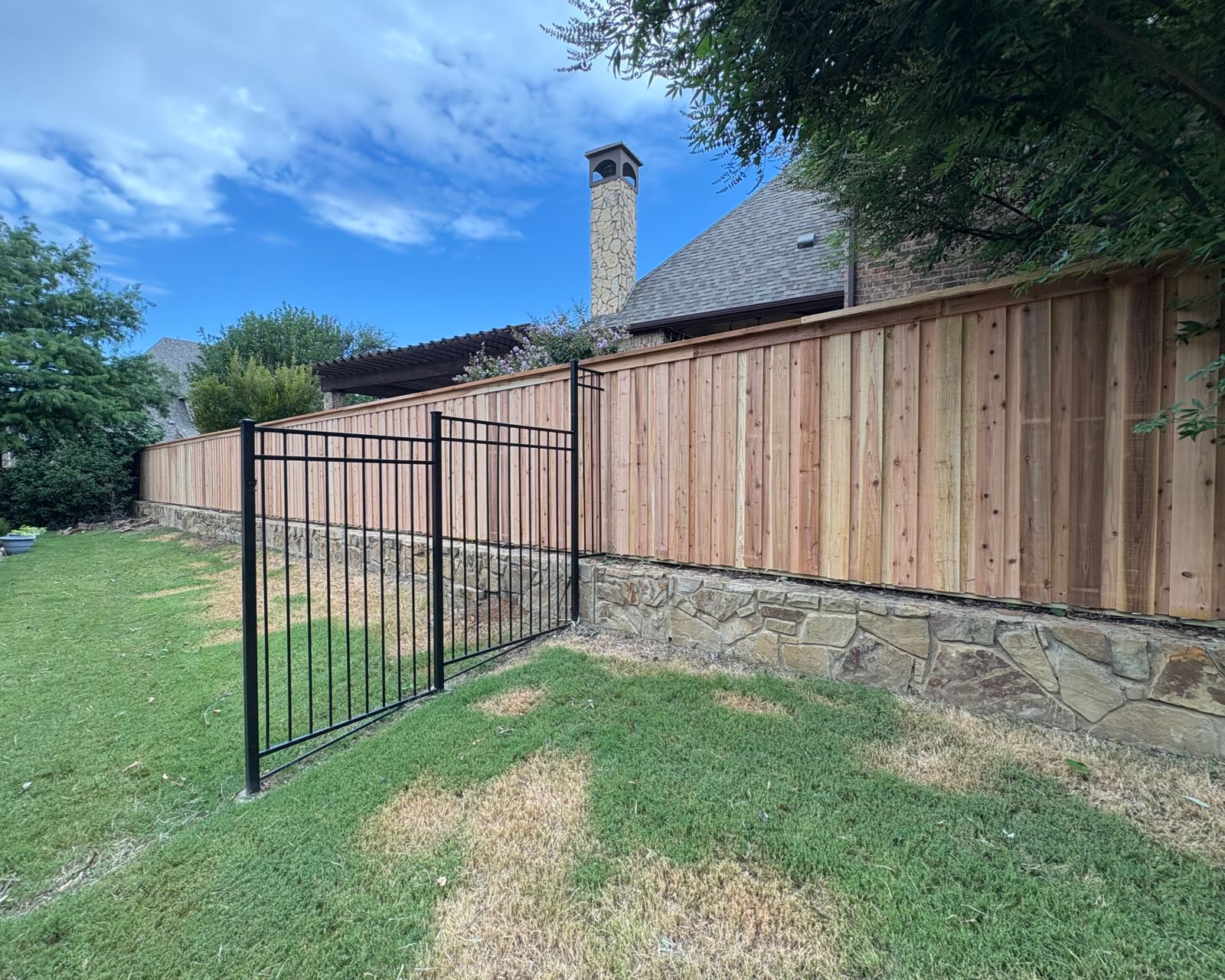 Wood fence staining and sealing on a DFW residential property