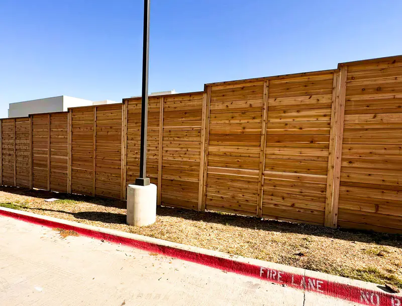 Horizontal cedar fencing installed at a Fort Worth, TX business