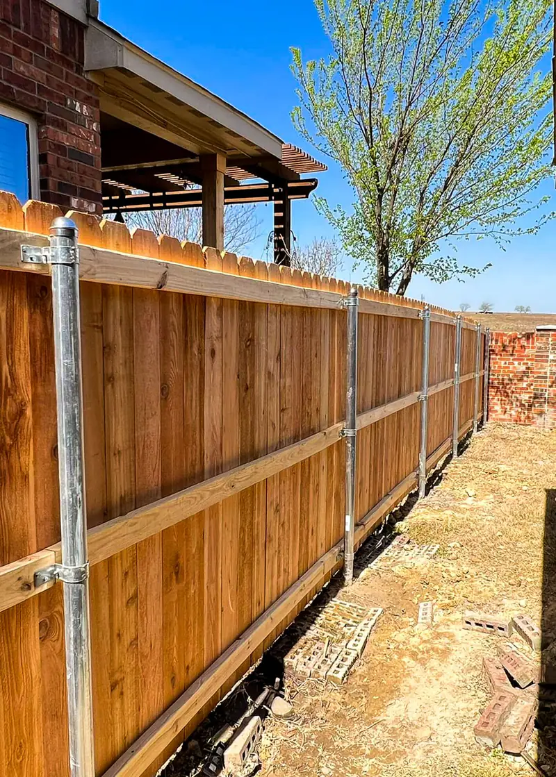 Cedar fence rebuilt on galvanized steel posts in Fort Worth, TX