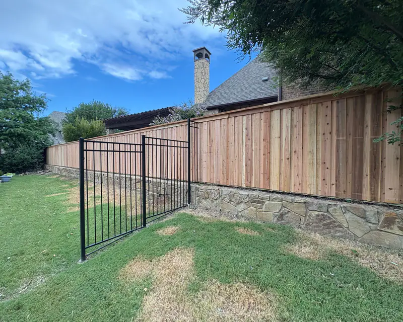 Cedar fence with wrought iron gate in Fort Worth, TX